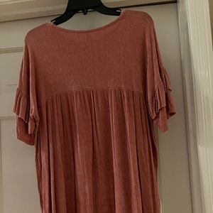 Very  soft burnt orange top. A medium or large? Oversized.